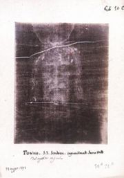 Shroud of Turin. Many people believe this to be the face of Jesus, and thus the face of God