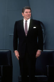 Reagan stands during the recommissioning ceremony for the battleship USS New Jersey.