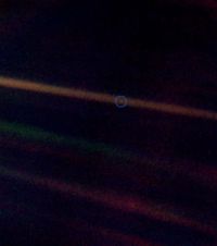 The Pale Blue Dot photo, a photo of Earth as a tiny dot (taken 4 billion miles from Earth by Voyager 1 at the edge of the solar system)