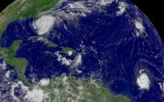 Hurricanes Frances (top left) and Ivan (bottom right) on September 5