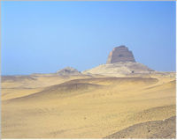 Sneferu's Pyramid at Meidum; the central core structure remains, surrounded by a mountain of rubble from the collapsed outer casing