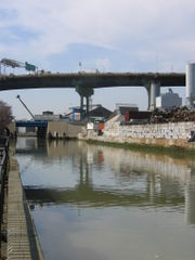 The Gowanus Canal, near Smith and 9th Street, with the Gowanus Expressway in the distance.