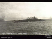 Australia on her side and sinking during her scuttling.