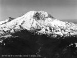 3,300 foot (1,000 m) high Willis Wall dominates the north face of the mountain (right center). Winthrop Glacier (left) is bounded by Steamboat Prow and Curtis Ridge.