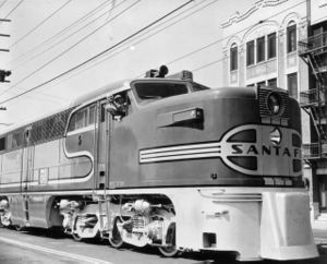 Ventriloquist Edgar Bergen and his "sidekick" Mortimer Snerd pose in the cab of Santa Fe #51L, lead locomotive on the Super Chief, in 1946. The unit was one of several placed on public display at Los Angeles' Exposition Park prior to entering regular service.