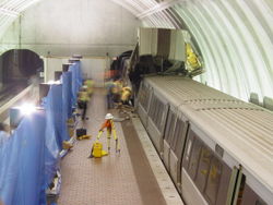 The accident at Woodley Park-Zoo/Adams Morgan station as seen the next day from the station mezzanine.  Trains were sharing the same track through the station at this time.