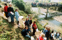 People waiting in line to gather water during the Siege of Sarajevo.