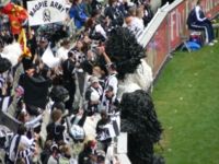 Cheersquads at Australian rules football matches behind the goals wave giant Pom-pons or floggers to signify a goal