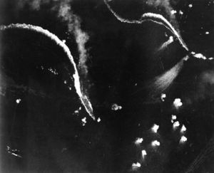 The Japanese aircraft carriers Zuikaku, left, and (probably) Zuihō come under attack by dive bombers early in the battle off Cape Engaño.