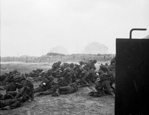 British troops take cover after landing on Sword Beach