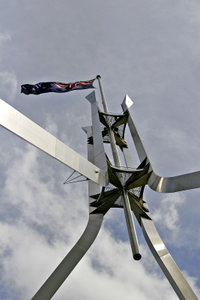 The flagpole on Parliament House is 81 metres tall and the flag measures 12.8 m by 6.4 m, about the size of half a tennis court.