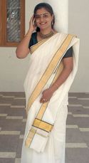 A Keralite Malayali woman wearing set sari 