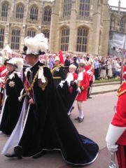 Queen Elizabeth in the robes of the Sovereign of the Order and the Duke of Edinburgh in the robes of a Royal Knight.