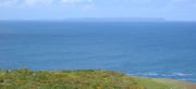 Viewed from Jersey's north coast, Jethou, Herm and Sark are hazy outlines on the horizon