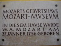 Plaque on wall outside Mozart's birthplace at Getreidegasse 9, Salzburg, Austria