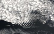 This wave cloud pattern formed off of the Île Amsterdam in the far southern Indian Ocean