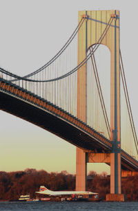 Concorde G-BOAD on a barge beneath Verrazano Narrows Bridge in New York City in November 2003, bound for the Intrepid Sea-Air-Space Museum.