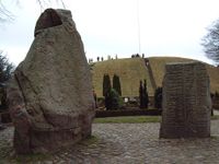 The Jelling Stones, Denmark's "birth certificate", seen from the north with "Gorm's Mound" in the background.