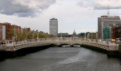 Dublin's Ha'penny Bridge Beyond it, the dome of the 18th century Custom House and Liberty Hall