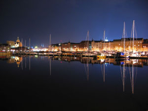 Pohjoisranta (The Northern Shore) at Night. On the left, Uspenski Cathedral. The twin towers of St. John's Church and the dome of Helsinki Cathedral are also visible.