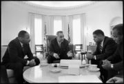 Lyndon B. Johnson meets with civil rights leaders Martin Luther King, Jr., Whitney Young, James Farmer