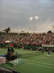 Henman (front) lost his first round 2006 Australian Open match to Russian Dmitry Tursunov.