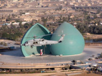 A helicopter flying by the Al-Shaheed Monument