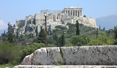 The speaker's platform in the Pnyx, the meeting ground of the assembly where all the great political struggles of Athens were fought out during the "Golden Age". Here Athenian statesmen stood to speak, such as Pericles and Aristides in the 5th century BC and Demosthenes and Aeschines in the 4th, along with countless humbler citizens as well.  In the background high on the Acropolis is the Parthenon, the temple of Athena, the city's protective goddess, looking down upon their deliberations.