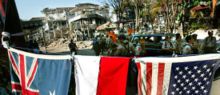 National flags at the explosion site in Kuta, Bali